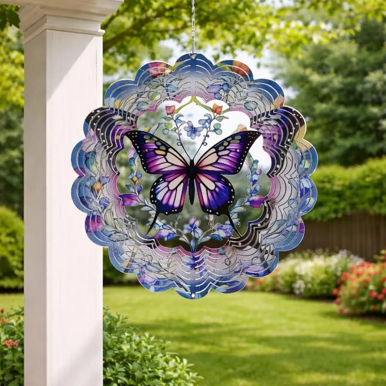 Colorful 3D butterfly mandala wind spinner hanging in a garden