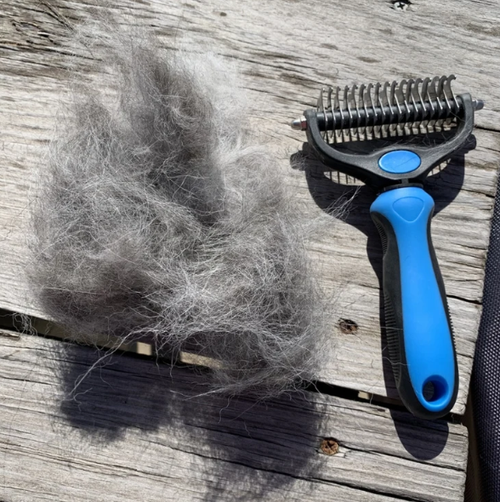 Double-sided pet comb for detangling and grooming cats and dogs; pet grooming tool